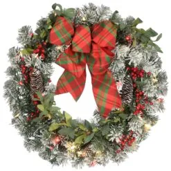 National Tree Company 24" General Store Snowy Wreath With LED Lights And Bow